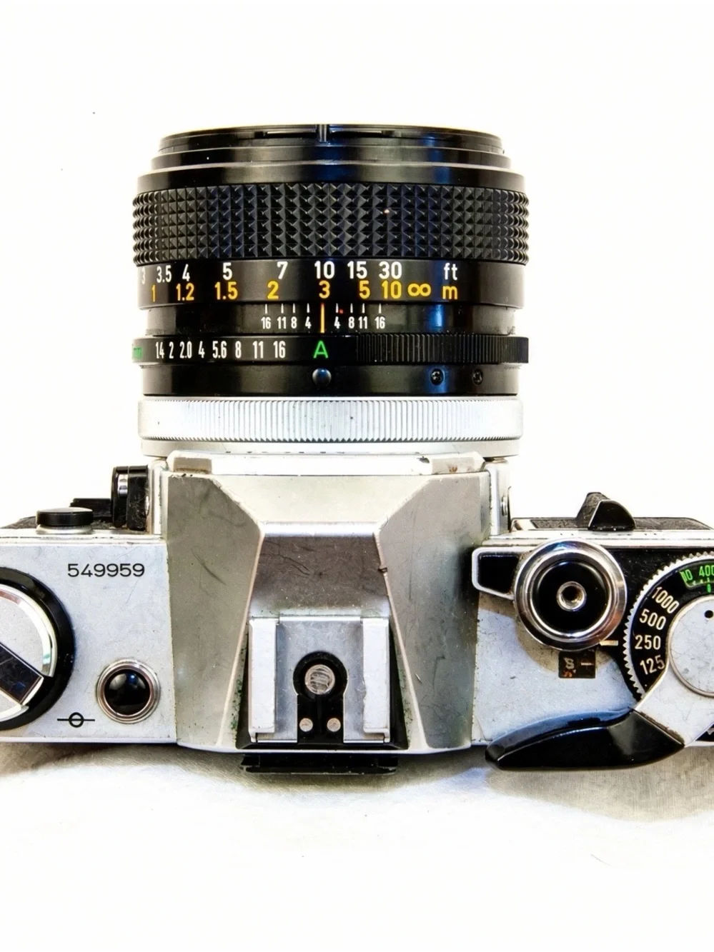 Canon silver and black AE-1 with 50mm f/1.4 and 70-210mm lenses